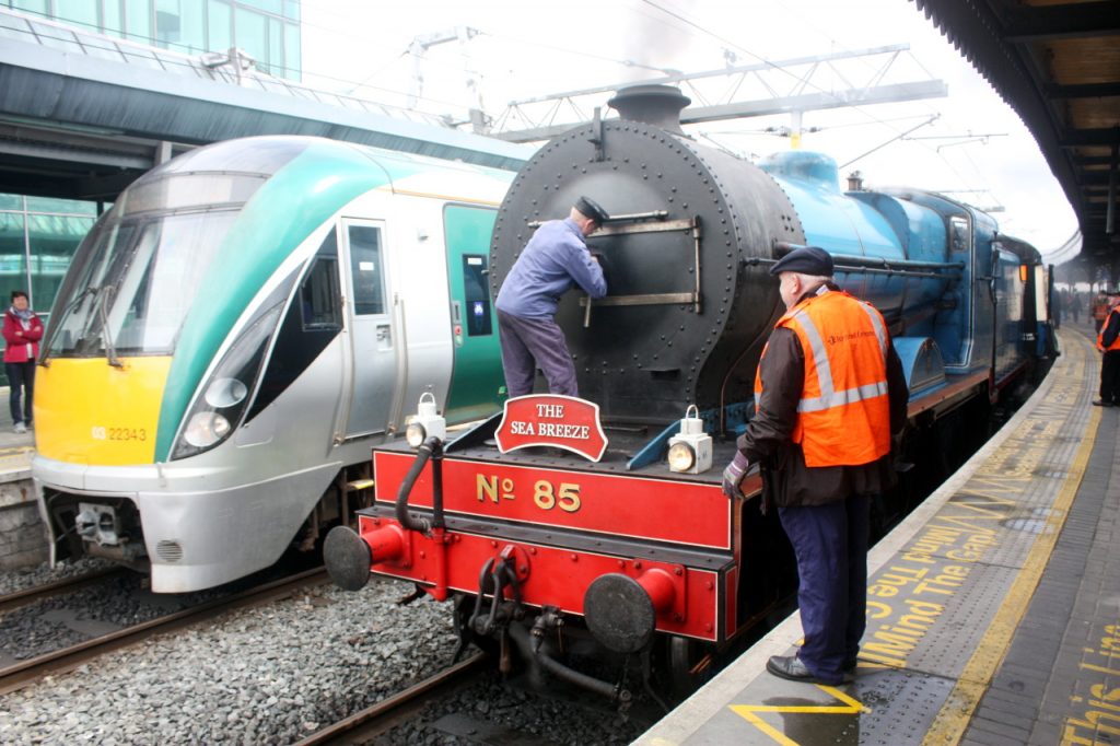 Photo of steam loco and modern railcar